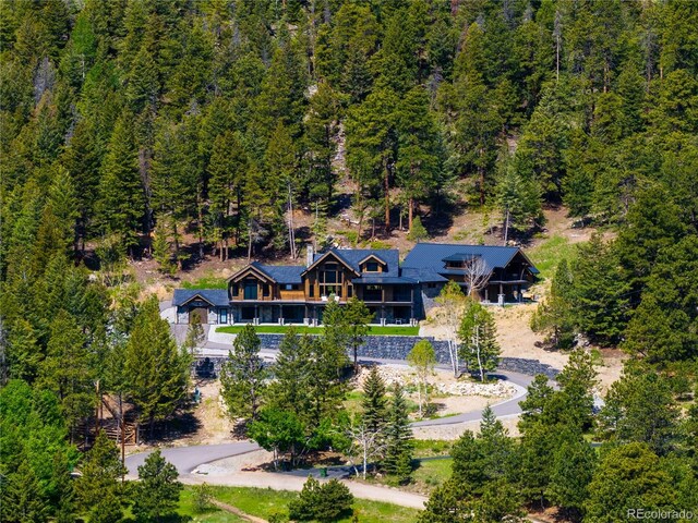 534 W Meadow Rd, Evergreen, CO 80439 - aerial view of property and surrounding area featuring a heavily wooded area