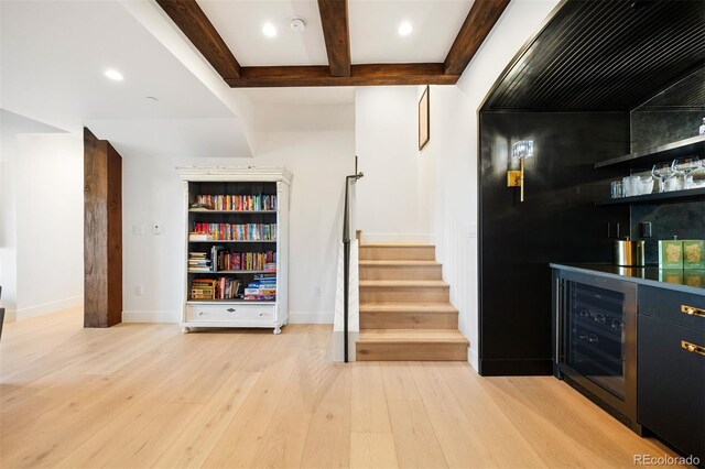 534 W Meadow Rd, Evergreen, CO 80439 - indoor dry bar featuring light wood finished floors, stairway, wine cooler, beam ceiling, and recessed lighting