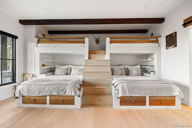 534 W Meadow Rd, Evergreen, CO 80439 - bedroom featuring beam ceiling and wood finished floors