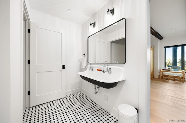 534 W Meadow Rd, Evergreen, CO 80439 - bathroom featuring a sink and baseboards