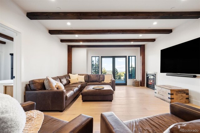 534 W Meadow Rd, Evergreen, CO 80439 - living area featuring light wood-style floors, recessed lighting, beamed ceiling, and a glass covered fireplace