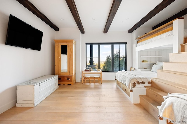 534 W Meadow Rd, Evergreen, CO 80439 - bedroom featuring beam ceiling and light wood-type flooring
