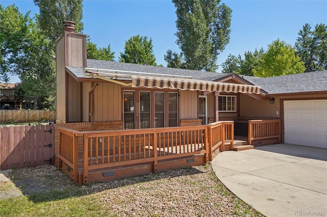 215 Sunland St, Louisville, CO 80027 - back of property featuring a shingled roof, a garage, a chimney, and crawl space