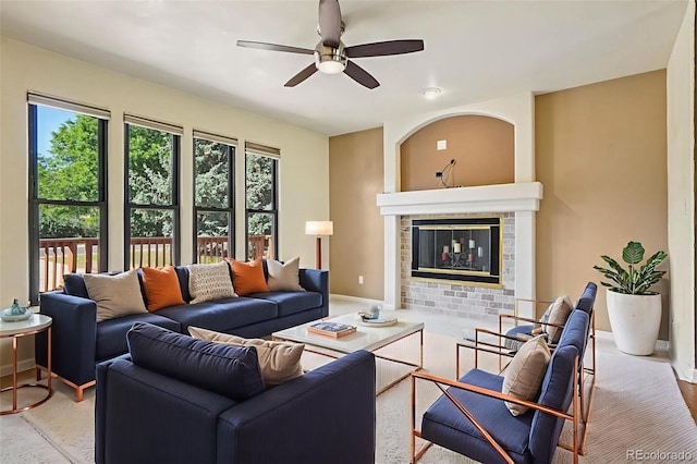 215 Sunland St, Louisville, CO 80027 - living area featuring a ceiling fan, healthy amount of natural light, and a glass covered fireplace
