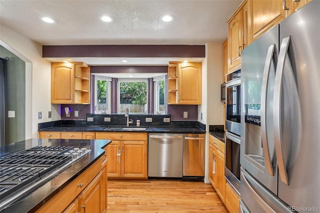 215 Sunland St, Louisville, CO 80027 - kitchen with stainless steel appliances, open shelves, light wood-style flooring, recessed lighting, and dark stone counters