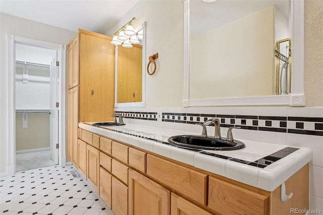 215 Sunland St, Louisville, CO 80027 - bathroom featuring double vanity and a walk in closet