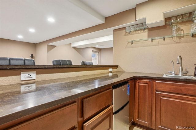 215 Sunland St, Louisville, CO 80027 - kitchen featuring freestanding refrigerator, brown cabinets, and recessed lighting
