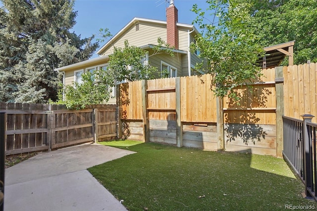 215 Sunland St, Louisville, CO 80027 - fenced backyard featuring a patio area