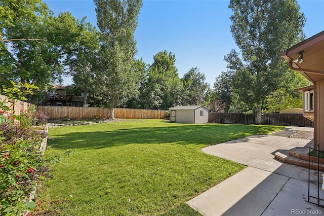 215 Sunland St, Louisville, CO 80027 - fenced backyard featuring a patio and a storage unit