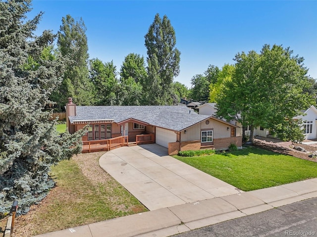 215 Sunland St, Louisville, CO 80027 - ranch-style home with a garage, a front lawn, concrete driveway, a chimney, and roof with shingles