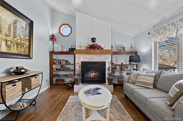 living room with crown molding, lofted ceiling, dark hardwood / wood-style floors, and a high end fireplace