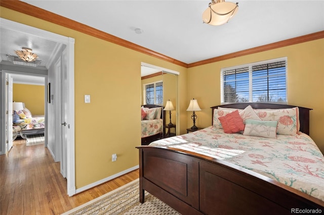 bedroom with crown molding and hardwood / wood-style flooring