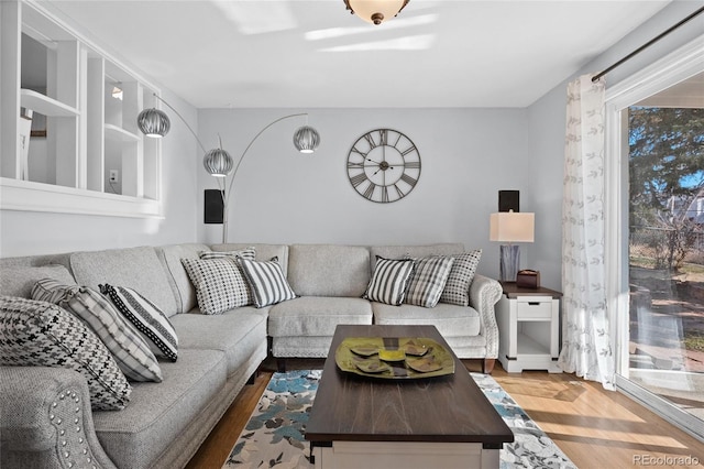 living room featuring a healthy amount of sunlight and hardwood / wood-style floors