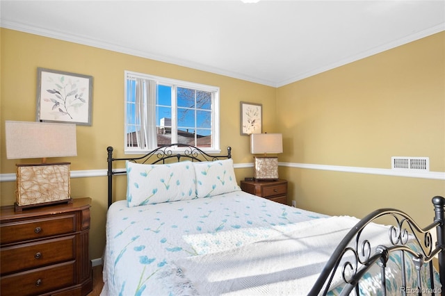 bedroom with ornamental molding