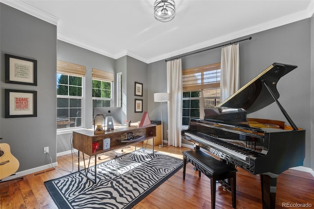 office featuring light hardwood / wood-style floors and ornamental molding