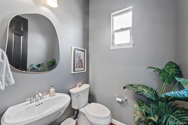 bathroom with toilet and sink