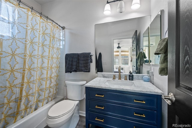 full bathroom with vanity, shower / tub combo, toilet, and ceiling fan