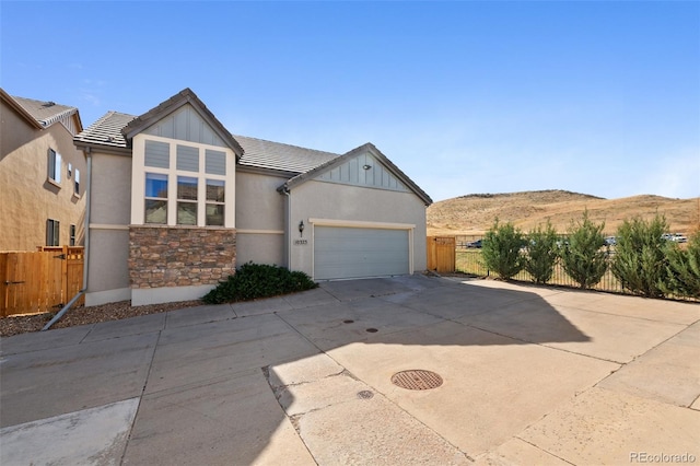 view of front of home featuring a mountain view and a garage