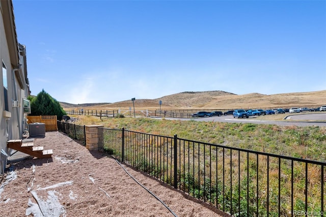 view of yard with a mountain view and cooling unit