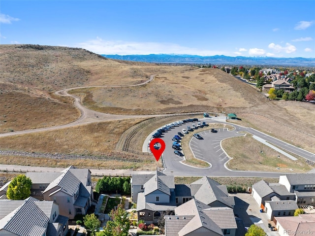 birds eye view of property with a mountain view