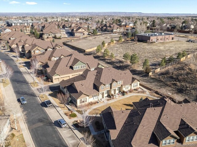 birds eye view of property with a residential view