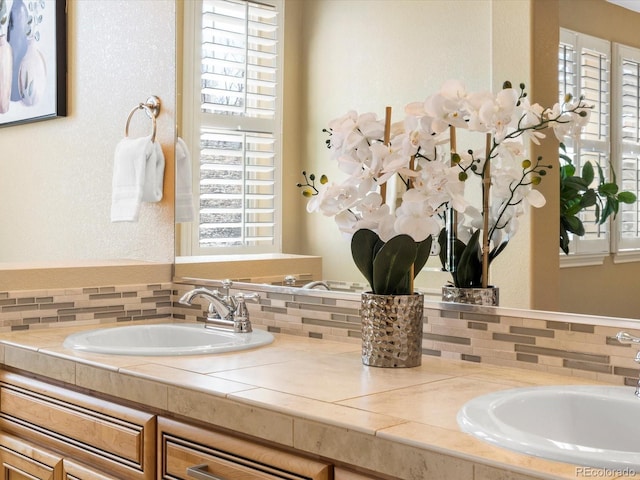 bathroom featuring double vanity and a sink