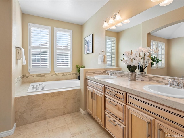 bathroom with tile patterned flooring, double vanity, a bath, and a sink