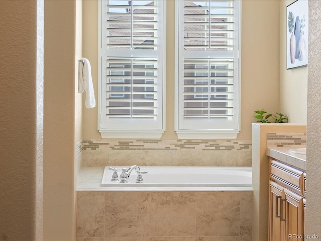 full bathroom with vanity and a garden tub