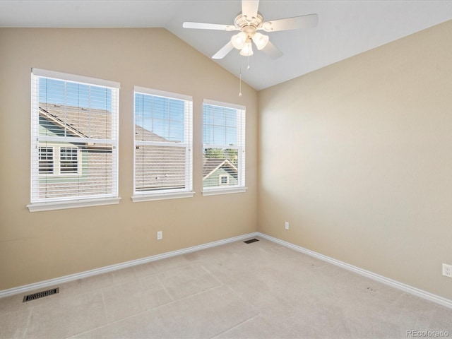 unfurnished room featuring visible vents, light carpet, baseboards, ceiling fan, and vaulted ceiling