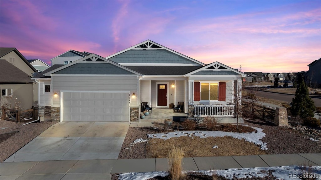 craftsman house featuring a porch and a garage