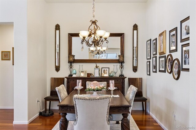 12189 Windy Trail Ln, Parker, CO 80138 - dining room with a chandelier, wood finished floors, and baseboards
