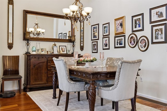 12189 Windy Trail Ln, Parker, CO 80138 - dining space featuring a chandelier, baseboards, and wood finished floors