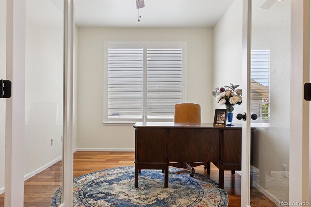 12189 Windy Trail Ln, Parker, CO 80138 - home office with a ceiling fan, wood finished floors, and baseboards