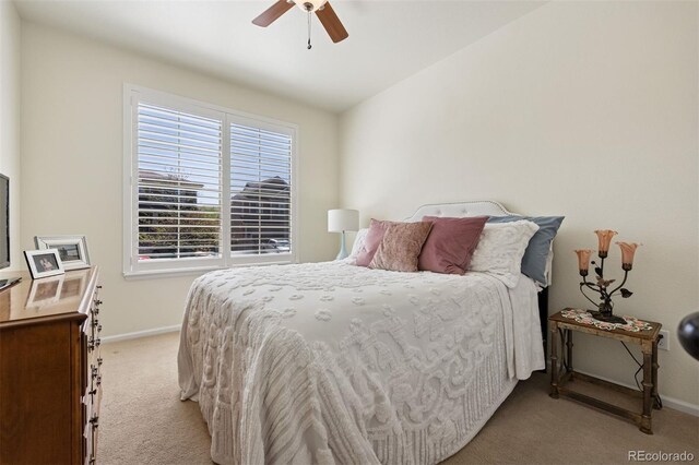 12189 Windy Trail Ln, Parker, CO 80138 - bedroom with light carpet, baseboards, and a ceiling fan