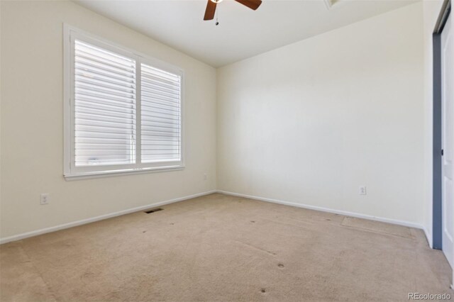 12189 Windy Trail Ln, Parker, CO 80138 - unfurnished room with light carpet, ceiling fan, and baseboards