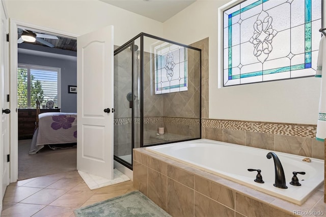 12189 Windy Trail Ln, Parker, CO 80138 - ensuite bathroom featuring a stall shower, a garden tub, a ceiling fan, and tile patterned flooring
