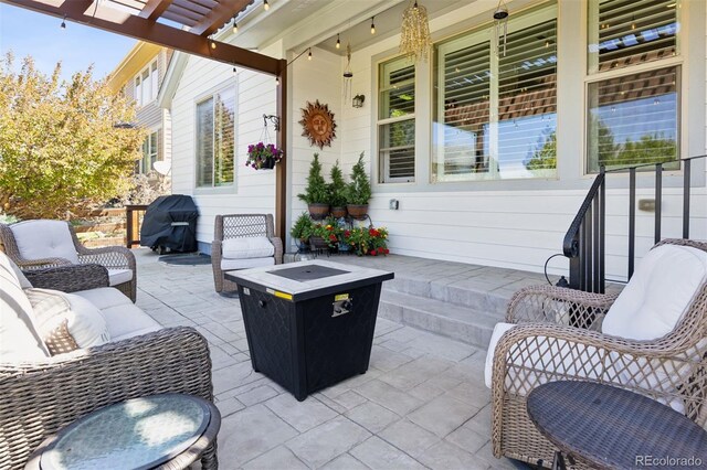 12189 Windy Trail Ln, Parker, CO 80138 - view of patio featuring an outdoor fire pit and a pergola