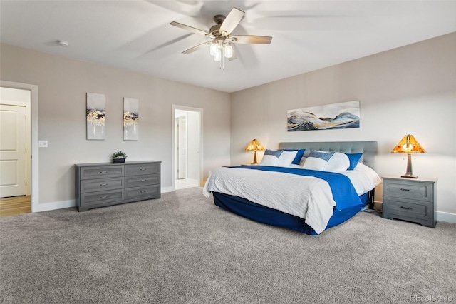 bedroom with ceiling fan, baseboards, and carpet floors