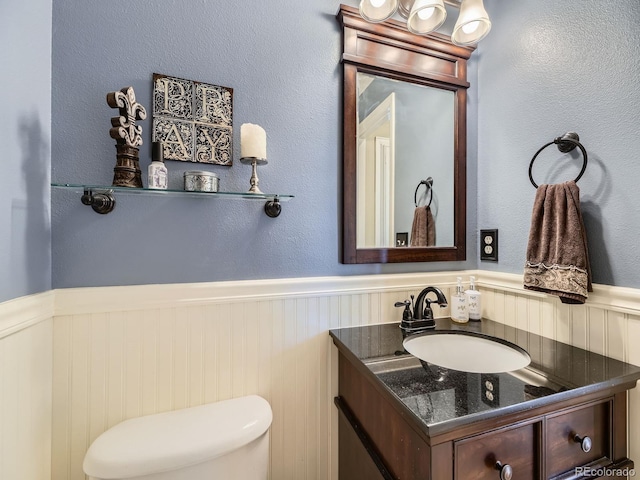 9625 S Hackberry St, Highlands Ranch, CO 80129 - half bathroom with wainscoting and vanity