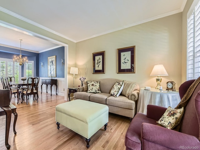 9625 S Hackberry St, Highlands Ranch, CO 80129 - living area with a chandelier, wood finished floors, and crown molding