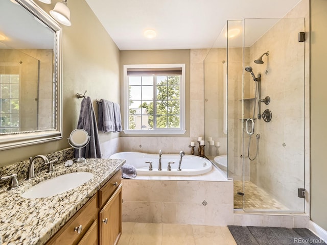 9625 S Hackberry St, Highlands Ranch, CO 80129 - full bath with a bath, vanity, a stall shower, and tile patterned flooring