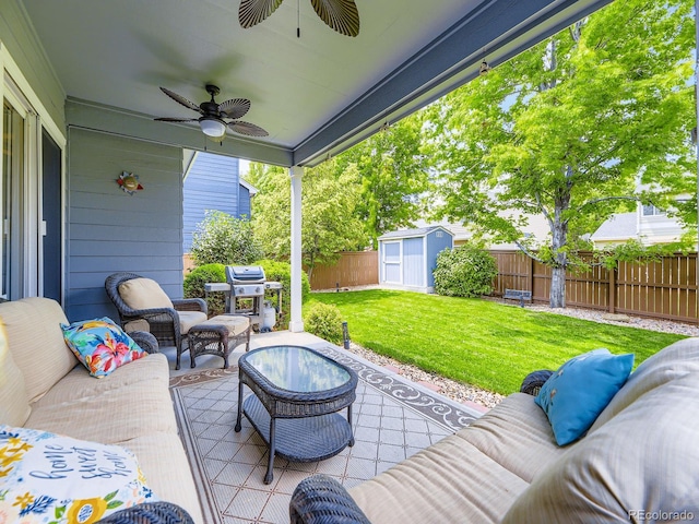 9625 S Hackberry St, Highlands Ranch, CO 80129 - fenced backyard featuring an outdoor hangout area, area for grilling, ceiling fan, a patio area, and a shed