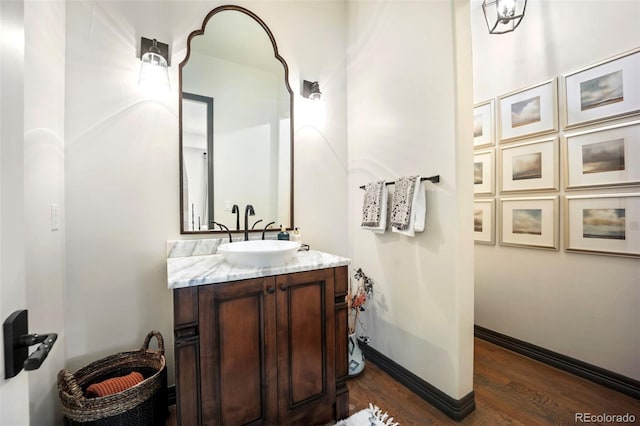 bathroom with vanity and wood finished floors