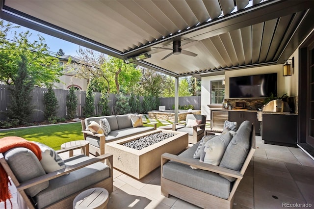 view of patio / terrace with area for grilling, a ceiling fan, a fenced backyard, and an outdoor living space with a fire pit