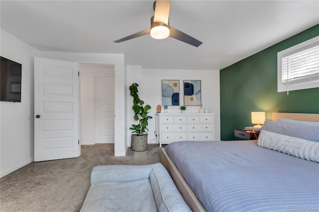 bedroom featuring carpet flooring, a ceiling fan, and baseboards