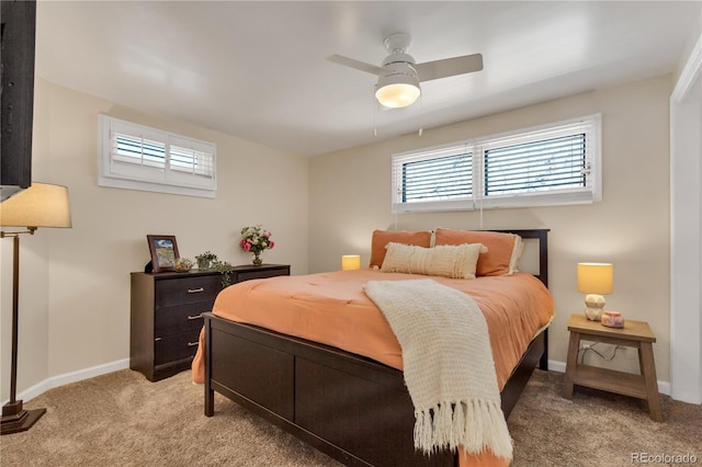 bedroom with baseboards, light colored carpet, and a ceiling fan