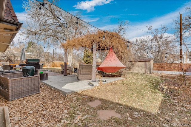 view of yard featuring a patio and fence