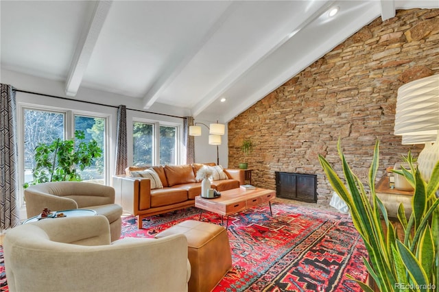 living area with a fireplace and lofted ceiling with beams