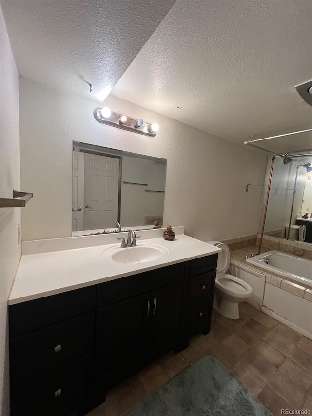 full bathroom featuring a textured ceiling, toilet, vanity, and tile floors