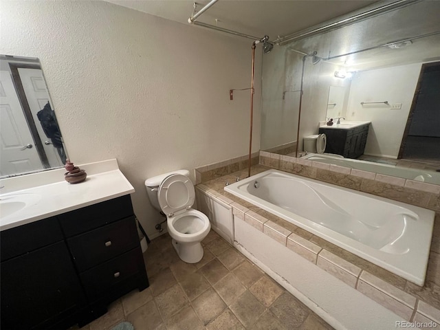 bathroom with tile floors, toilet, and vanity